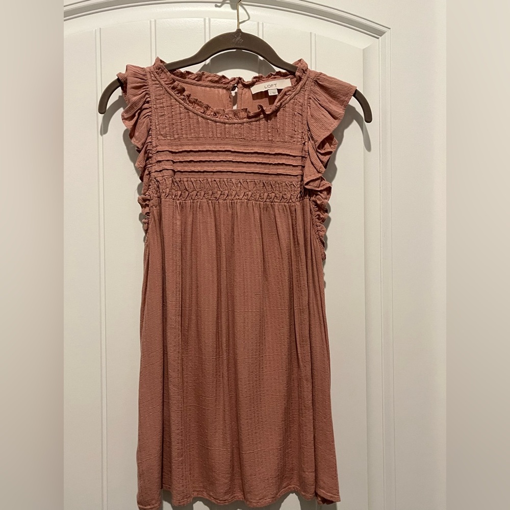 Blush colored sleeveless top with ruffles